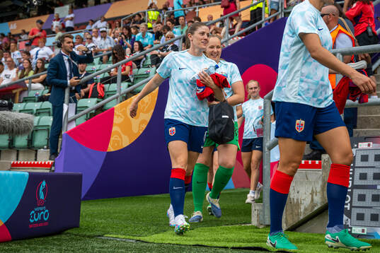 Maren Mjelde and goalkeeper Aurora Mikalsen of Norway