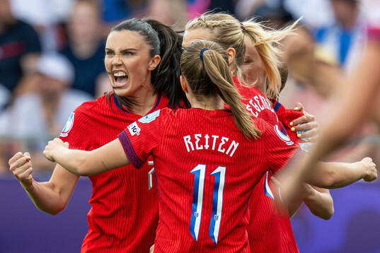 Ingrid Syrstad Engen of Norway celebrates with teammates