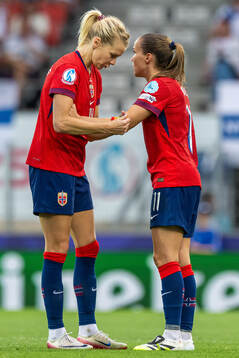Ada Hegerberg of Norway gives the captains’ armband to
