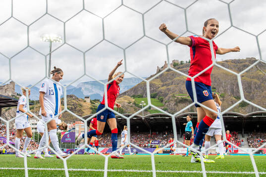 Ada Hegerberg and Guro Reiten of Norway celebrate