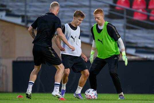 Hugo Bolin and goalkeeper Joakim Persson