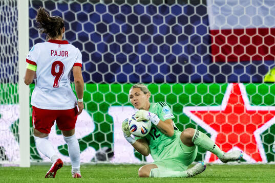 Ewa Pajor of Poland and goalkeeper Jennifer Falk of Sweden