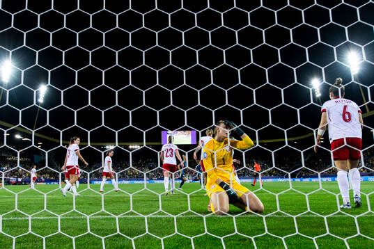 Goalkeeper Kinga Szemik of Poland looks dejected