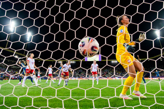 Kosovare Asllani of Sweden celebrates and goalkeeper Kinga