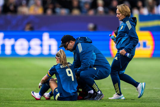 Kosovare Asllani of Sweden receives medical treatment