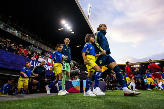 Goalkeeper Jennifer Falk and Kosovare Asllani of Sweden