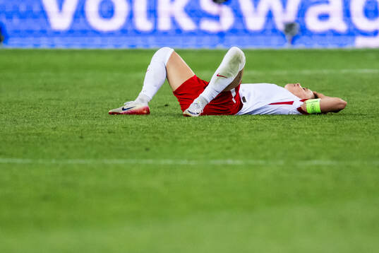 Ewa Pajor of Poland looks dejected