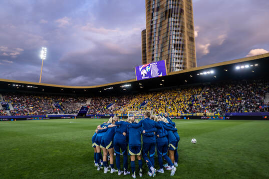 Players of Sweden gather with team mates