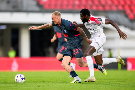 Daniel Gudjohnsen of Malmö FF and Dhoraso Moreo Klas of FC
