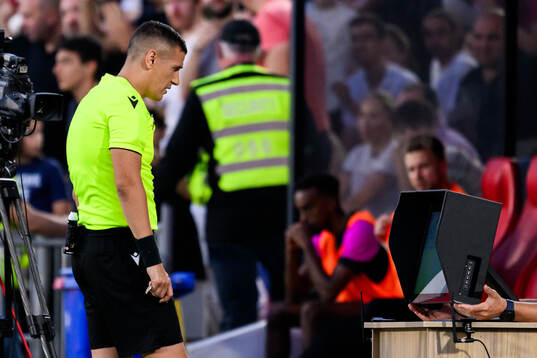 Referee Igor Stojchevski check the VAR screen