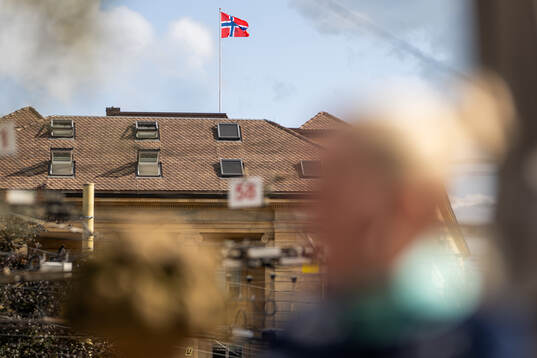The Norwegian flag is seen at the top of Hotel Beau-Rivage