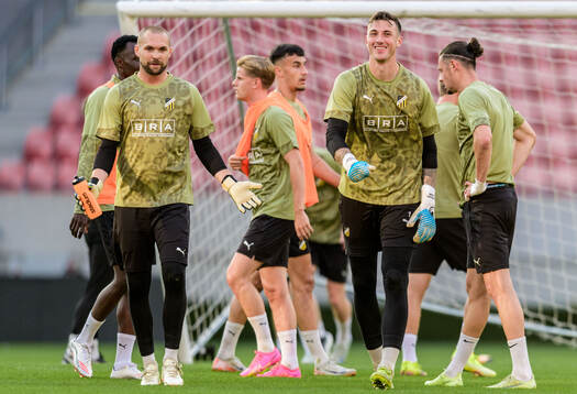 Goalkeeper Oscar Jansson and goalkeeper Andreas Linde of