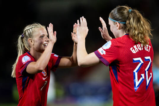 Emilie Woldvik and Signe Gaupset of Norway celebrate