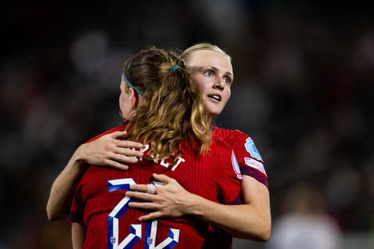 Signe Gaupset and Karina Sævik of Norway celebrate