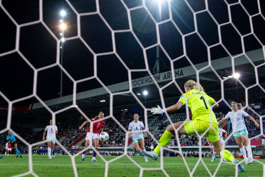 Frida Maanum of Norway scores 3-1 behind goalkeeper Cecilia