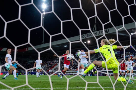 Frida Maanum of Norway scores 3-1 behind goalkeeper Cecilia