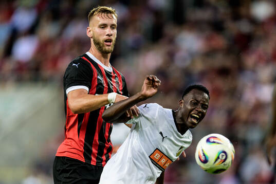 Milos Kratochvil of Spartak Trnava and John Paul Dembe of