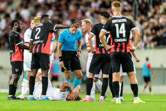 Silas Andersen of Häcken and Referee Bence Csonka