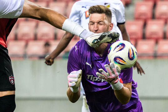 Goalkeeper Ziga Frelih of Spartak Trnava get Silas Andersen