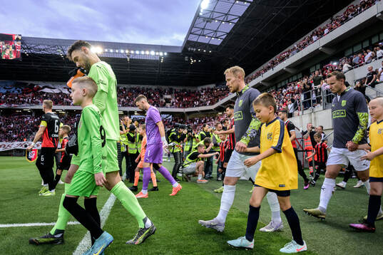 Goalkeeper Etrit Berisha and Mikkel Rygaard Jensen of
