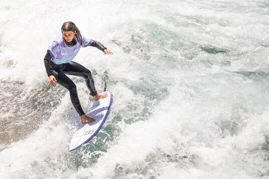A surfer with the Norwegian away kit