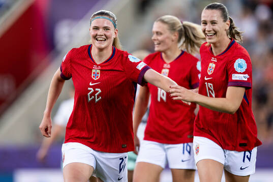 Signe Gaupset of Norway celebrates with Elisabeth Terland