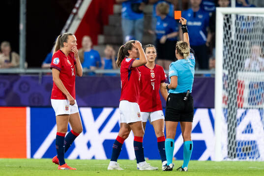 Marit Bratberg Lund of Norway receives a red card