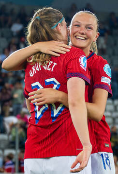 Signe Gaupset and Frida Maanum of Norway celebrate