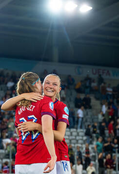 Signe Gaupset and Frida Maanum of Norway celebrate