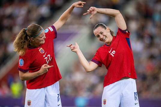 Signe Gaupset of Norway celebrates with teammate Elisabeth
