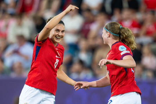 Signe Gaupset of Norway celebrates with teammate Vilde Bøe