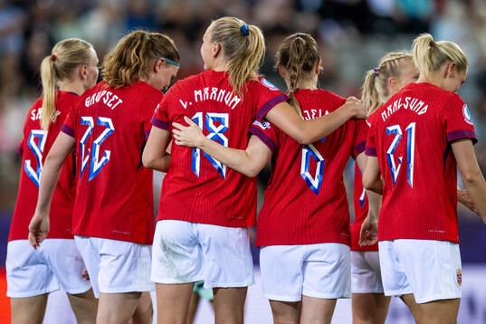 Frida Maanum of Norway celebrates with Maren Mjelde and
