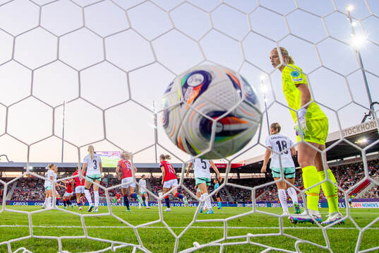 Signe Gaupset of Norway scores the 1-1 goal behind