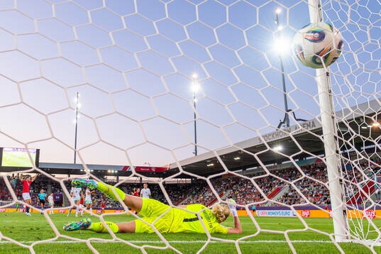Signe Gaupset of Norway scores the 2-1 goal behind