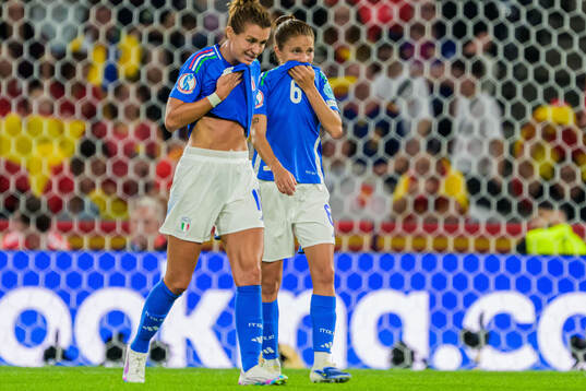 Manuela Giugliano and Cristiana Girelli of Italy looks