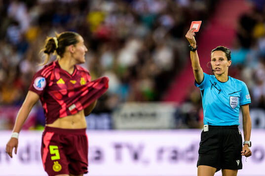 Carlotta Wamser of Germany is shown a red card from Referee