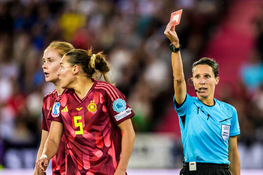Carlotta Wamser of Germany is shown a red card from Referee
