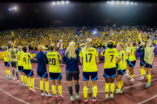 Players of Sweden celebrates with supporters