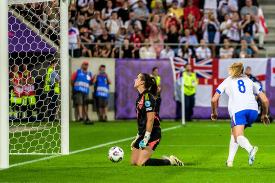 Goalkeeper Olivia Clark of Wales looks dejected while