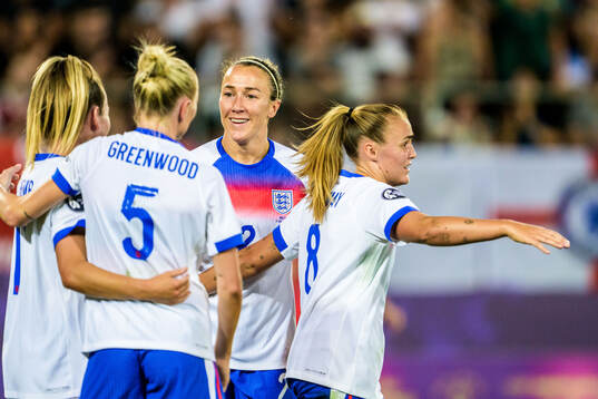 Lauren Hemp celebrates