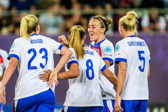 Lucy Bronze of England celebrates