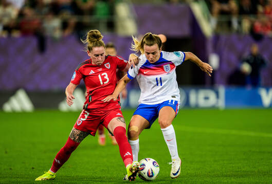 Rachel Rowe of Wales and Lauren Hemp of England
