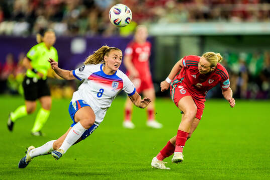 Georgia Stanway of England and Rhiannon Roberts of Wales