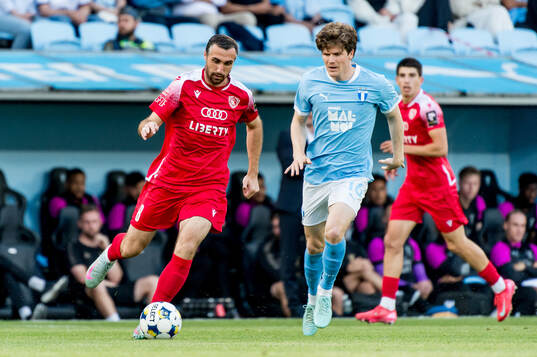 Bakar Kardava of FC Iberia and Oliver Berg of Malmö FF