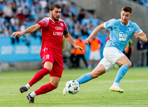 Gizo Mamageishvili of FC Iberia and Lasse Berg Johnsen of