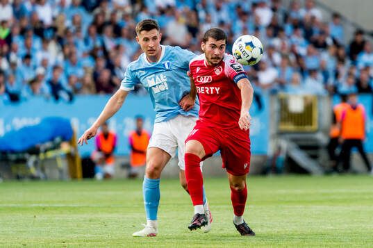 Lasse Berg Johnsen of Malmö FF and Gizo Mamageishvili of