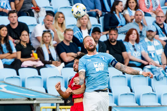 Pontus Jansson of Malmö FF and Giorgi Tabatadze of FC