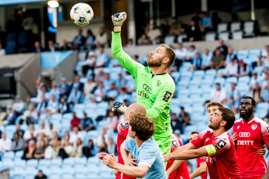 Giorgi Makaridze of FC Iberia and Oliver Berg of Malmö FF