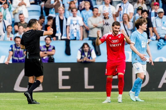 Gizo Mamageishvili of FC Iberia is shown a red card from