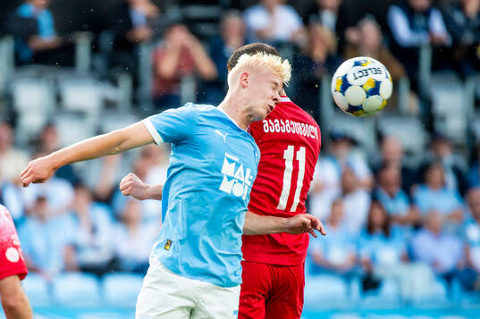Otto Rosengren of Malmö FF and Gizo Mamageishvili of FC